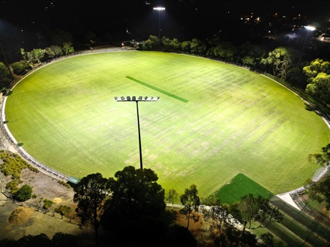 Drone view of North Ringwood Reserve at night with the new lights shining onto the ground